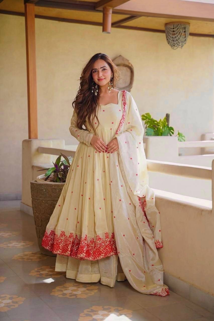 Exquisite Beige Flared Anarkali Suit Set Adorned with Vibrant Red Floral Embroidery, Sequined Scalloped Hem, and an Elegant Tie-Up Back